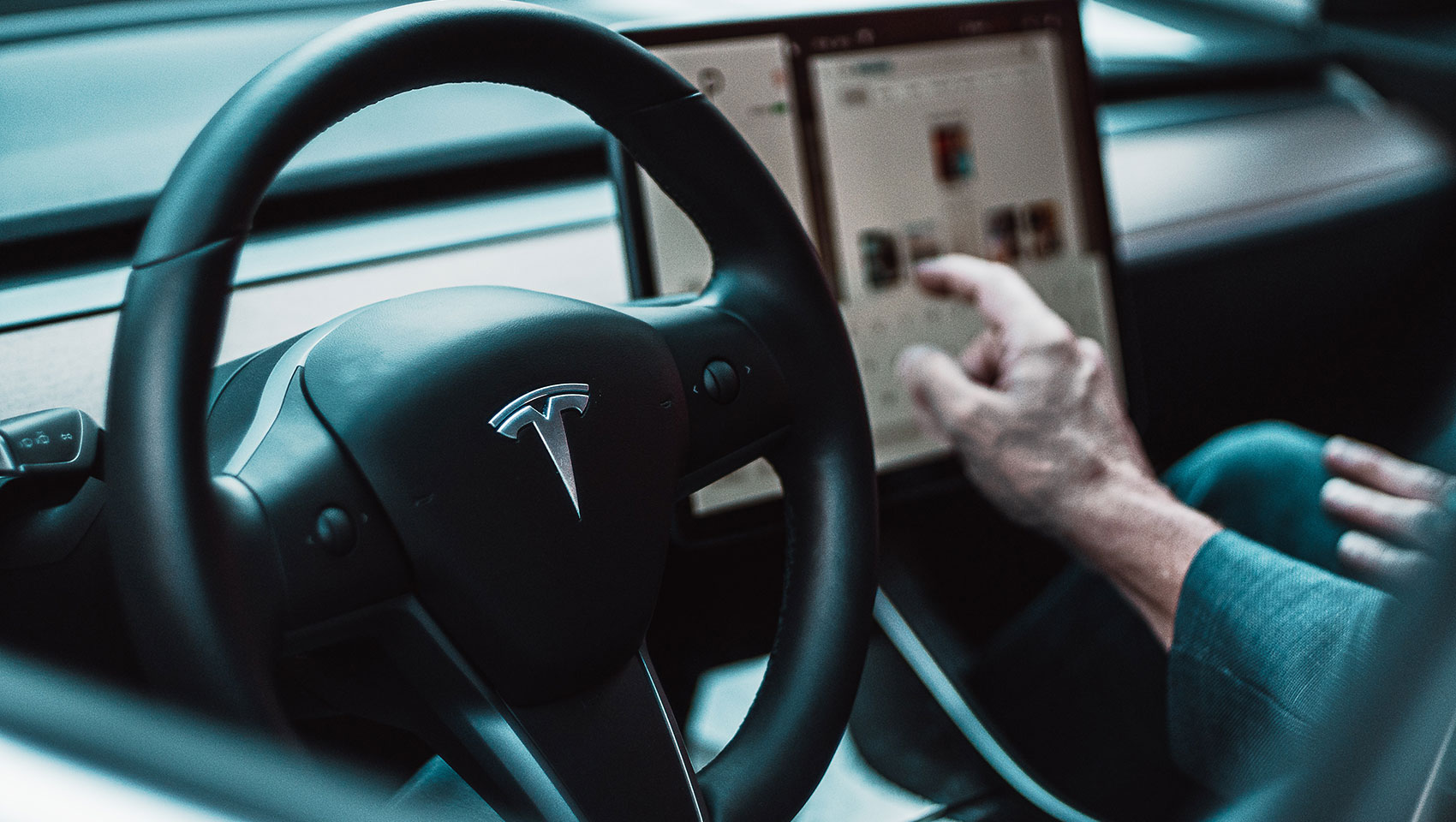 driver reaching for navigation