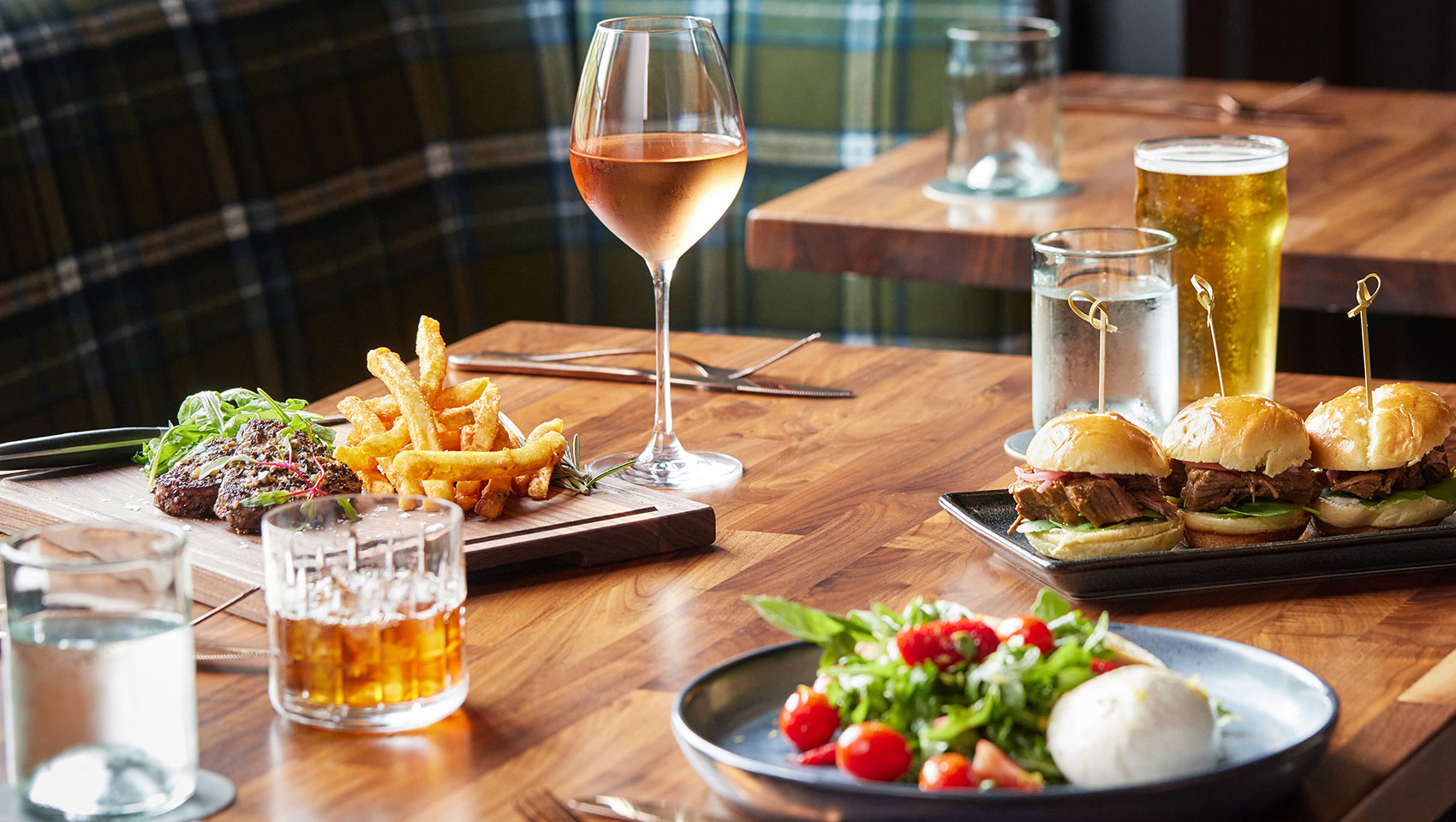 Image of elevated bar food and drinks at The Good Sport in The Forum Hotel