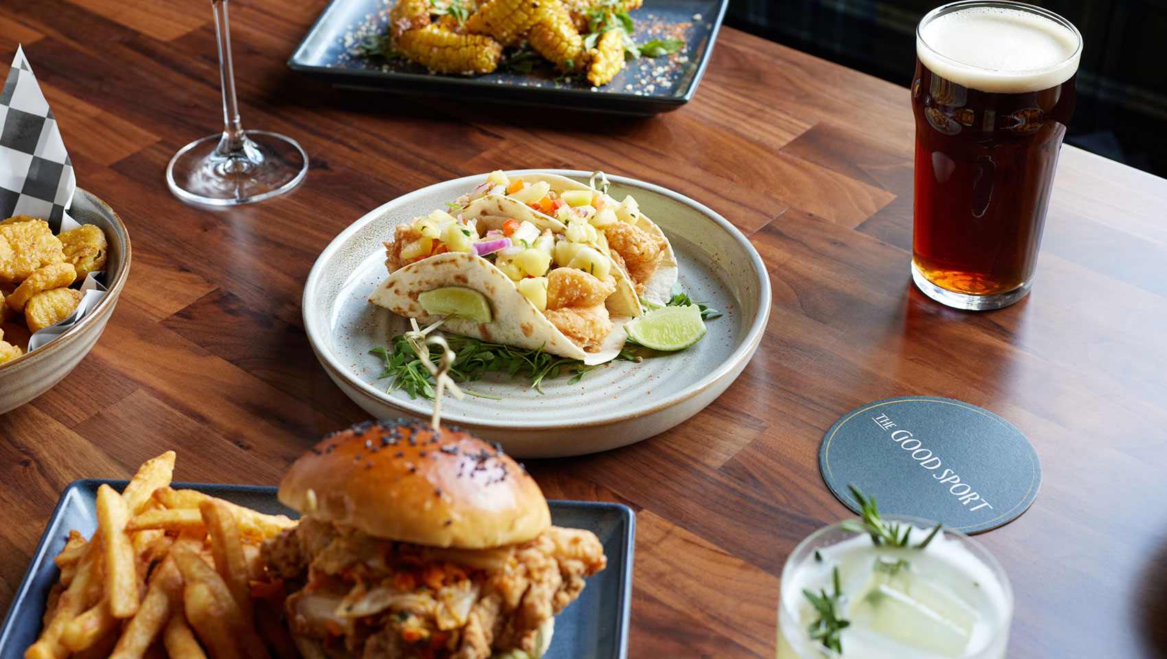 Image of elevated bar food and drinks at The Good Sport in The Forum Hotel