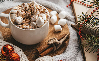 cozy hot chocolate and marshmallows in cup
