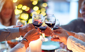 people cheersing at a holiday dinner